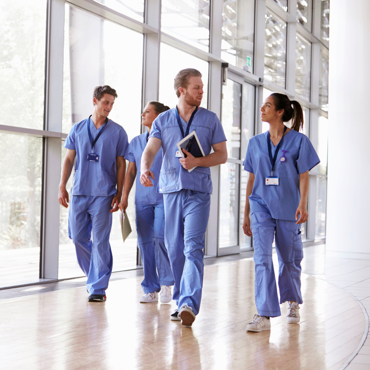 Diverse allied health professionals collaborating in a clinical setting during National Allied Health Professions Week