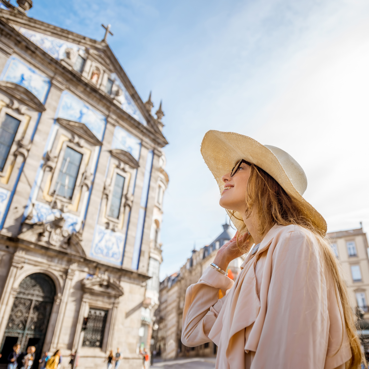 A woman enjoying travel therapy while exploring a historic European cathedral.