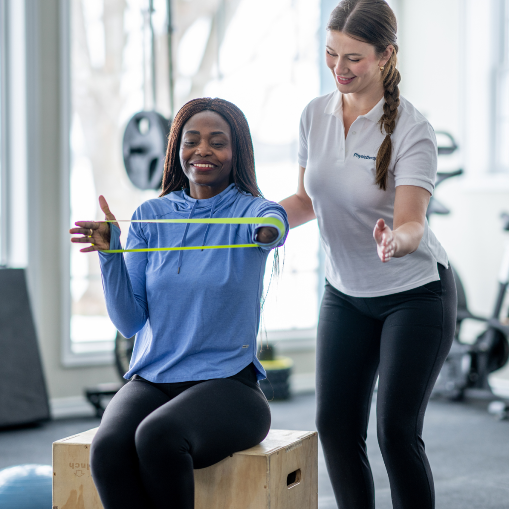Physical therapy assistant supporting a child during a balance and coordination exercise in a rehabilitation setting. 