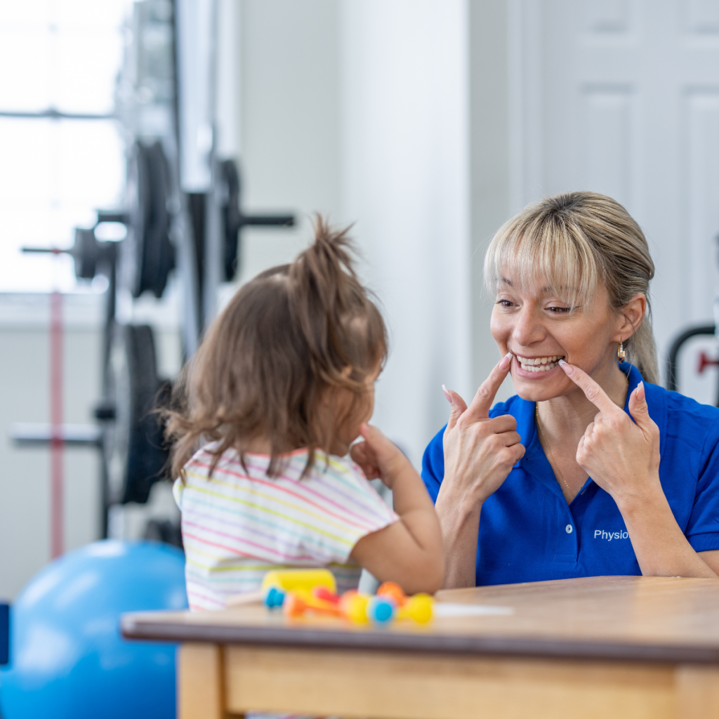 pediatric-speech-pathologist-early-intervention-demand A pediatric specialist engaging a young child in speech exercises, illustrating high-demand opportunities in early intervention and pediatric clinics.